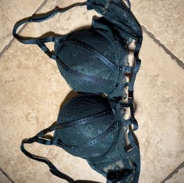 Dark green bra with a push and decorated with rhinestones