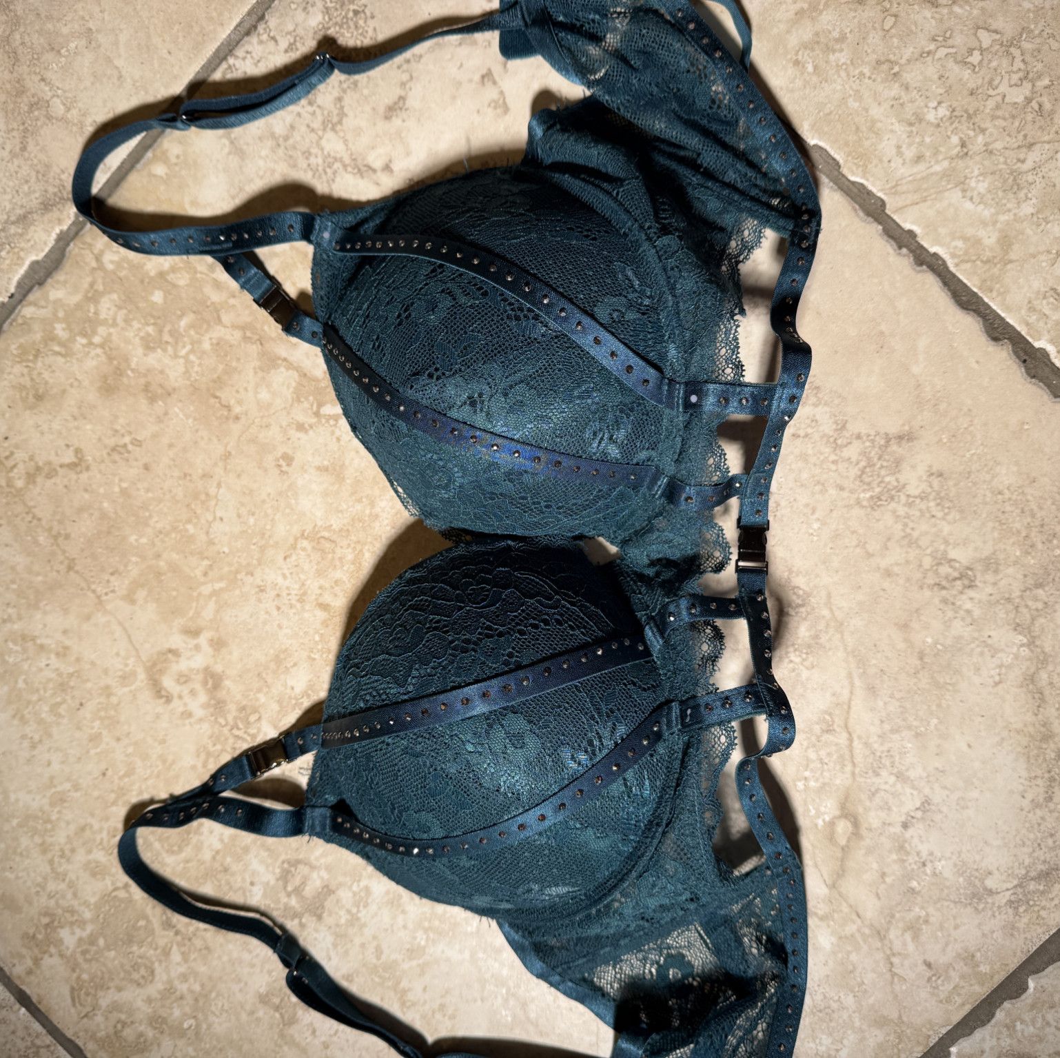 Dark green bra with a push and decorated with rhinestones