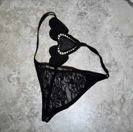Transparent nylon black thongs on a rope