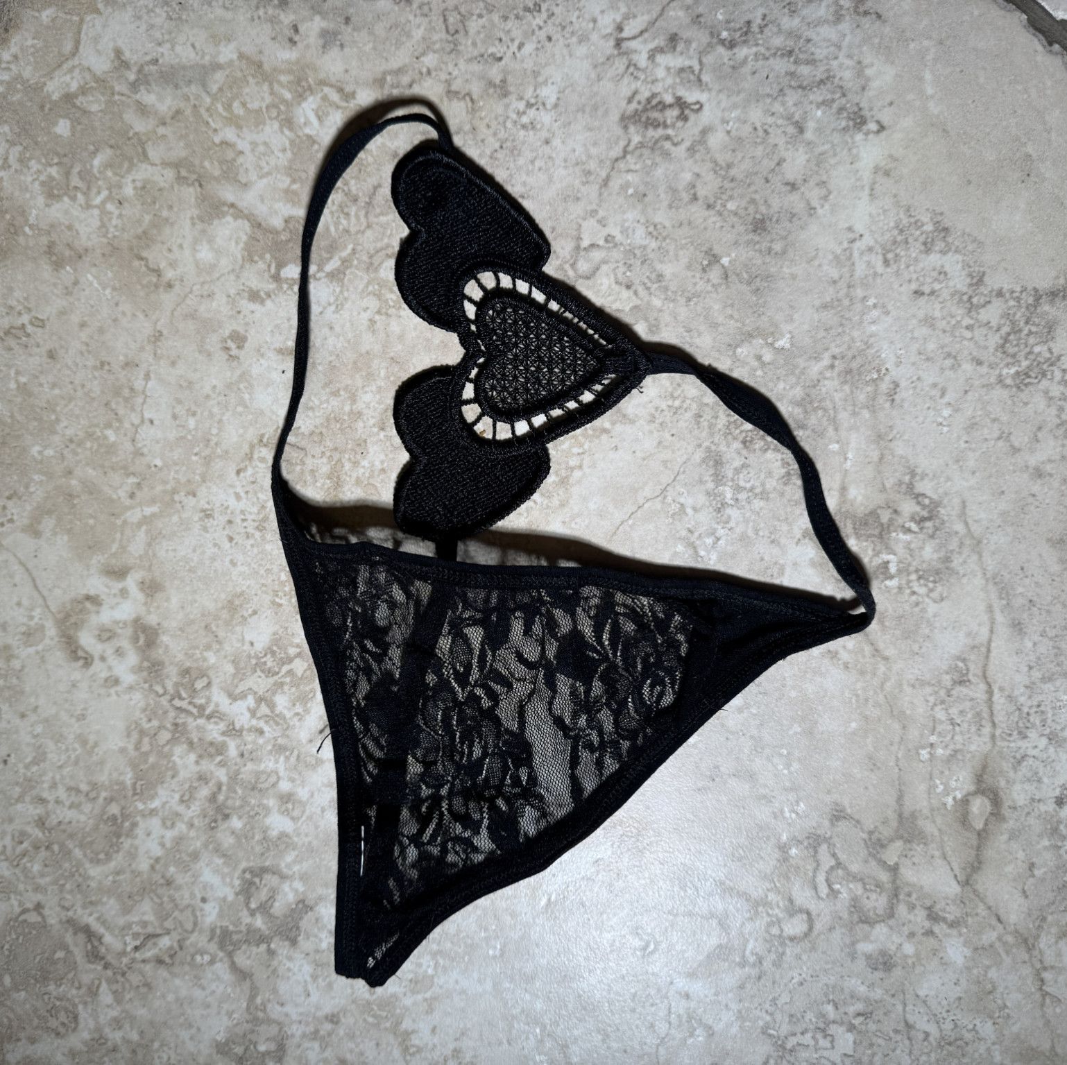 Transparent nylon black thongs on a rope