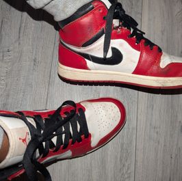Red trashed Jordans