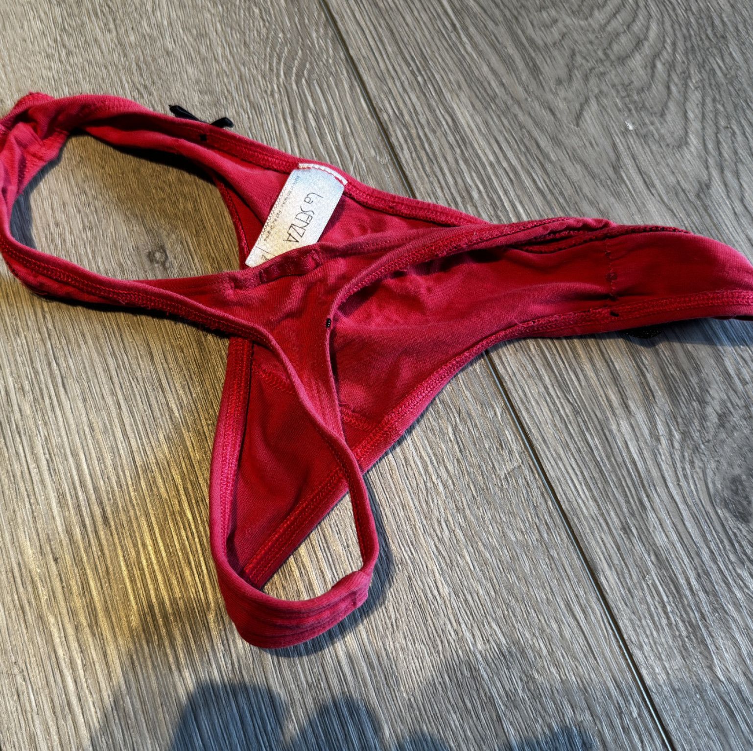 Well worn red thong