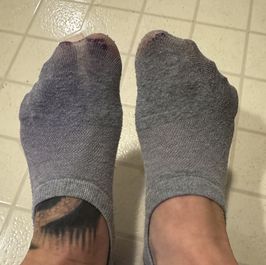 Old well worn ankle socks