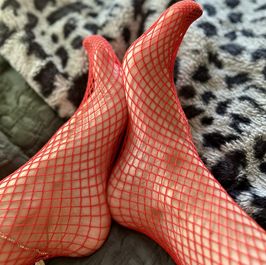 Feet in red fishnets