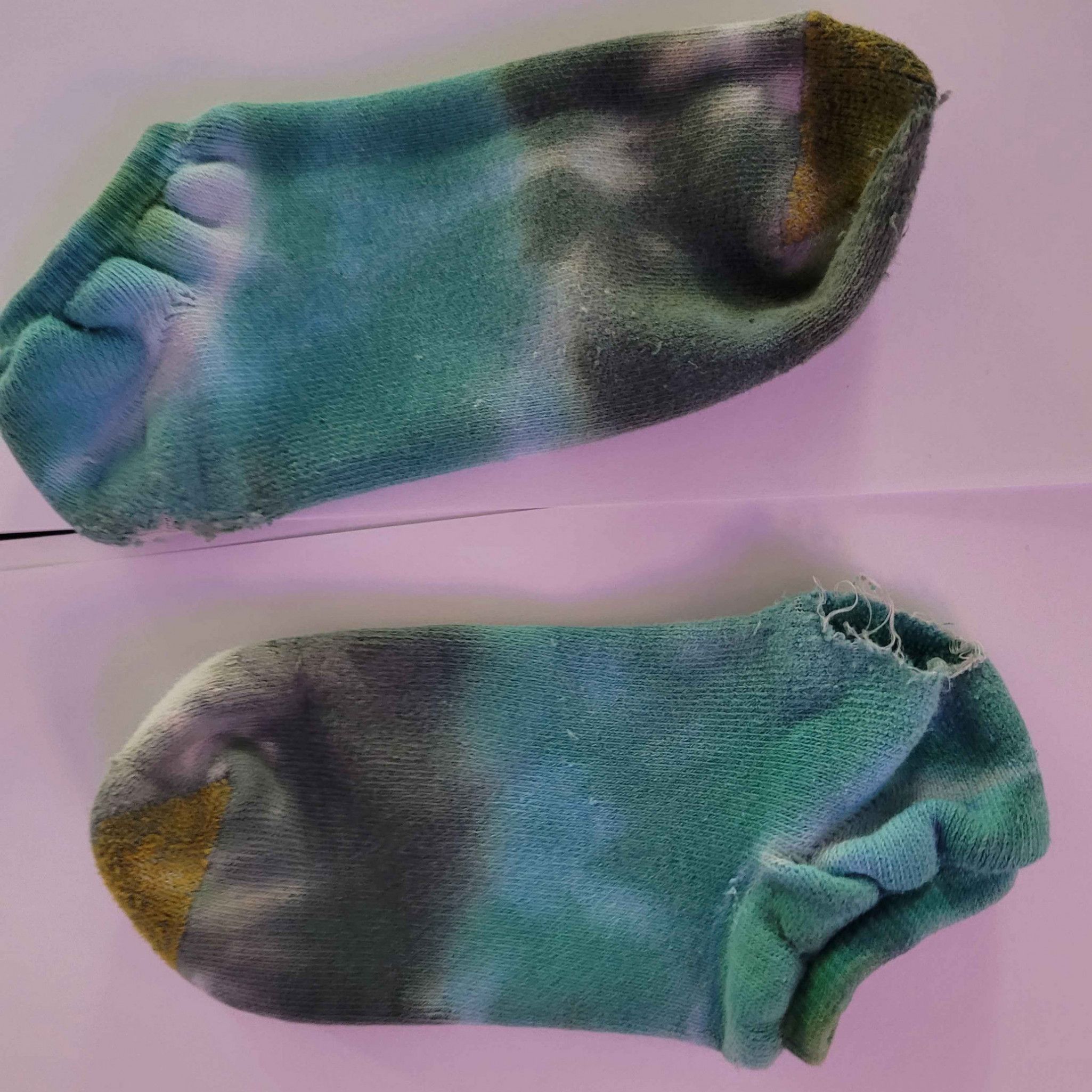 Gamer girl worn through old green socks
