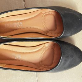 Worn Black Ballet Flats