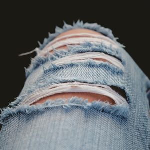 Worn Ripped Denim Jeans
