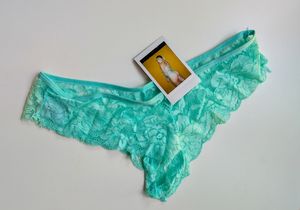 Teal panties with Polaroid