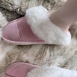 Worn pink fluffy slippers