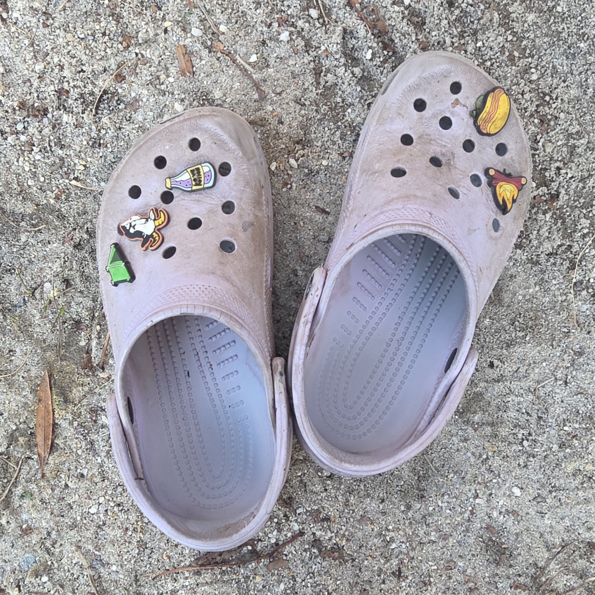 Worn Purple Crocs with Charms