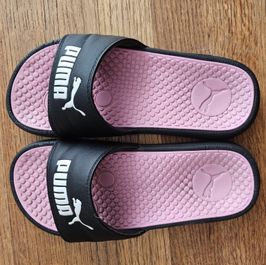Well worn and smelly Puma slides