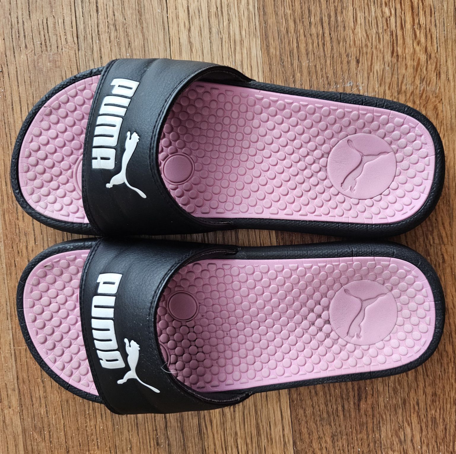 Well worn and smelly Puma slides