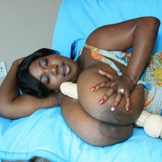 Huge Dildo in between these huge tits