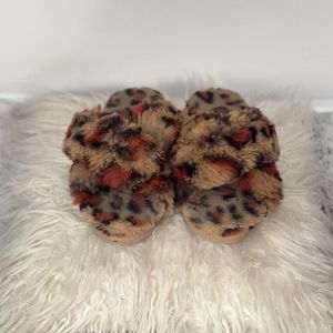 Puffy cheetah print slides