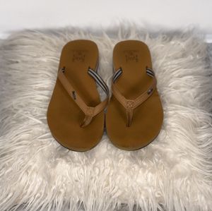 Brown beachy flip flops