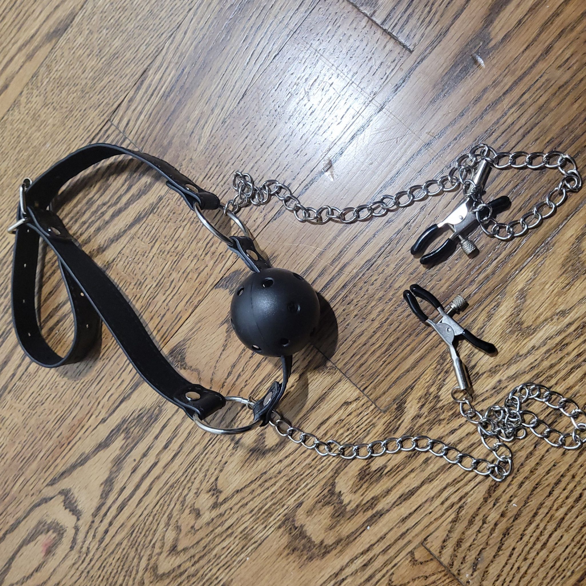 Worn Ball Gag with Chained Nipple Clamps