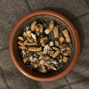 Full ashtray of cork butts