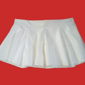 Worn short white pvc skirt