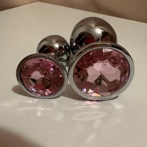 Little and large pink steel buttplugs