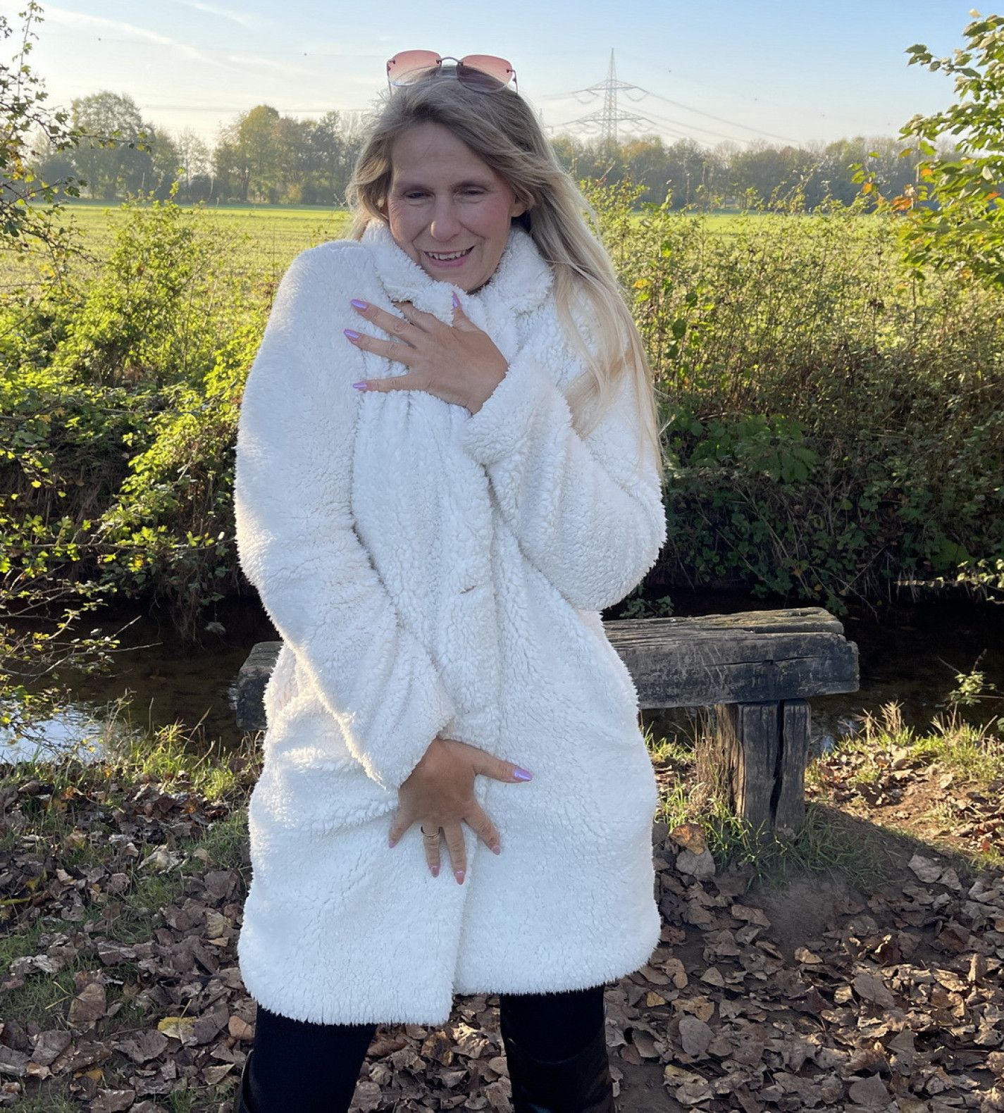 In a cuddly coat and boots