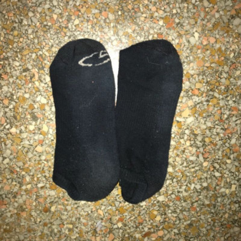 Worn out black socks
