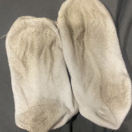 Dirty filthy white cotton trainer socks