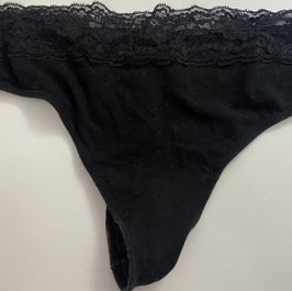 Worn black thong
