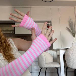 white and pink gloves