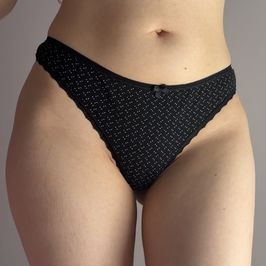 Black thong with white polka dots