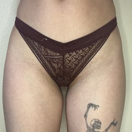 Worn maroon lace thong