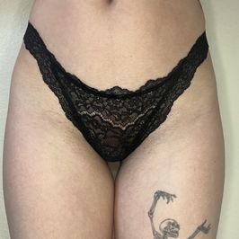 Worn black lace thong