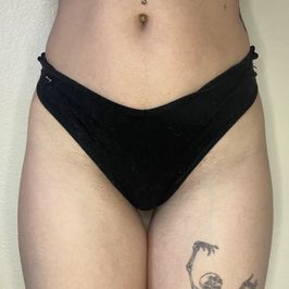 Worn black bikini panties