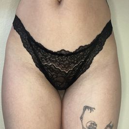 Worn black lace thong