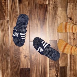 blue adidas gym slides worn