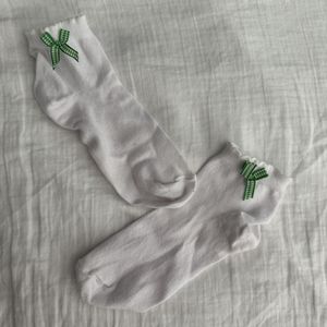 Cute white socks with green bow