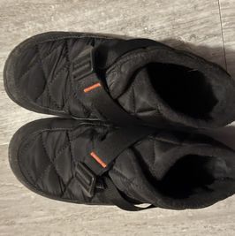 Worn Black Womens Snow Boots