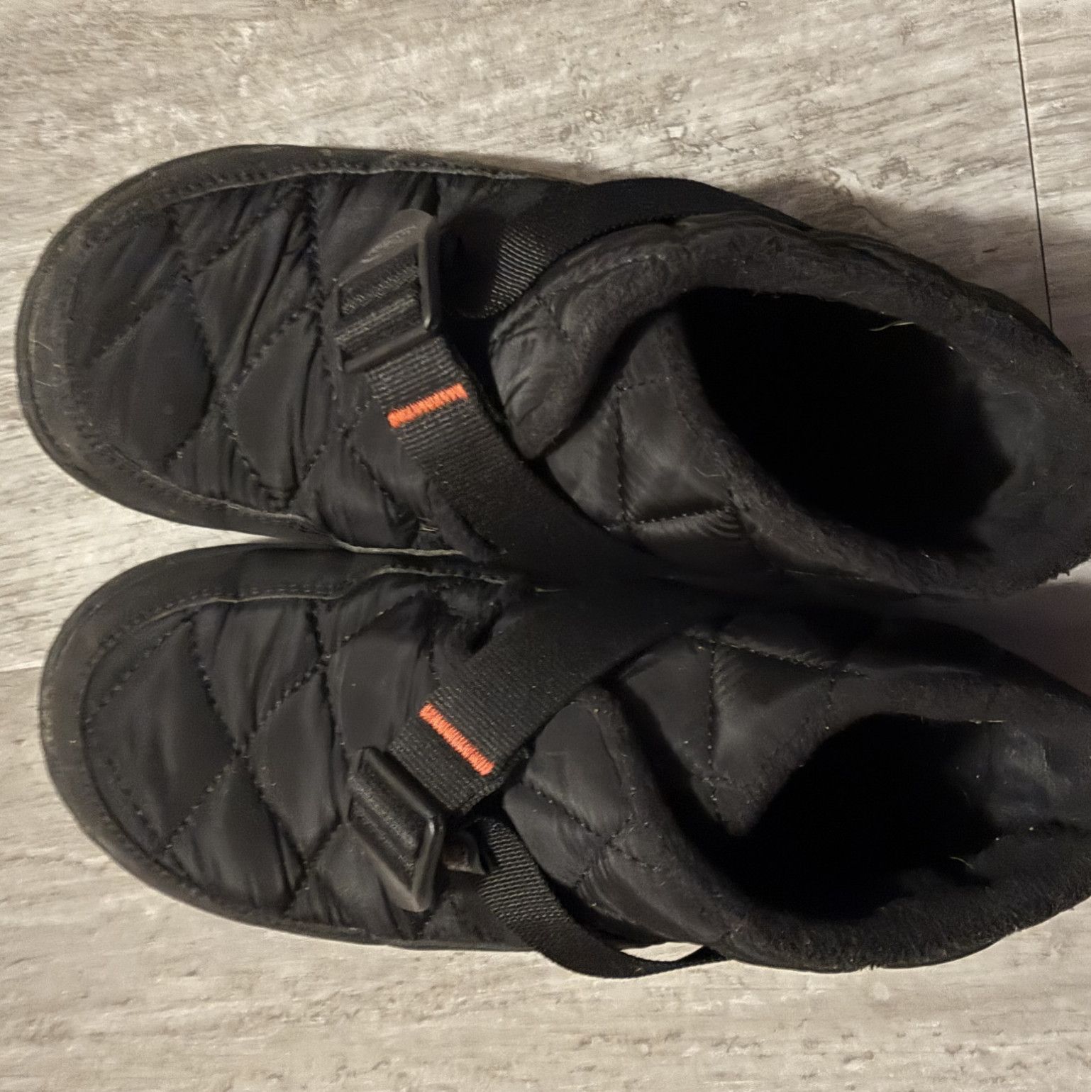 Worn Black Womens Snow Boots