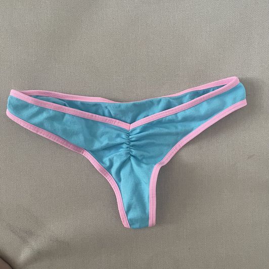 worn blue and pink ruched thong