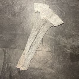 Very well worn white fishnet thigh high stockings