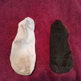 dirty mismatched socks lightly worn