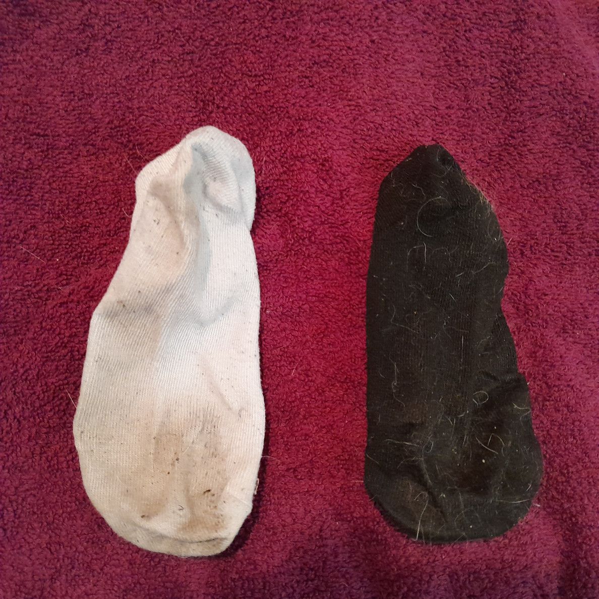 dirty mismatched socks lightly worn