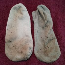 dirty mismatched socks very worn
