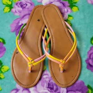 Worn in Brown Flip Flops