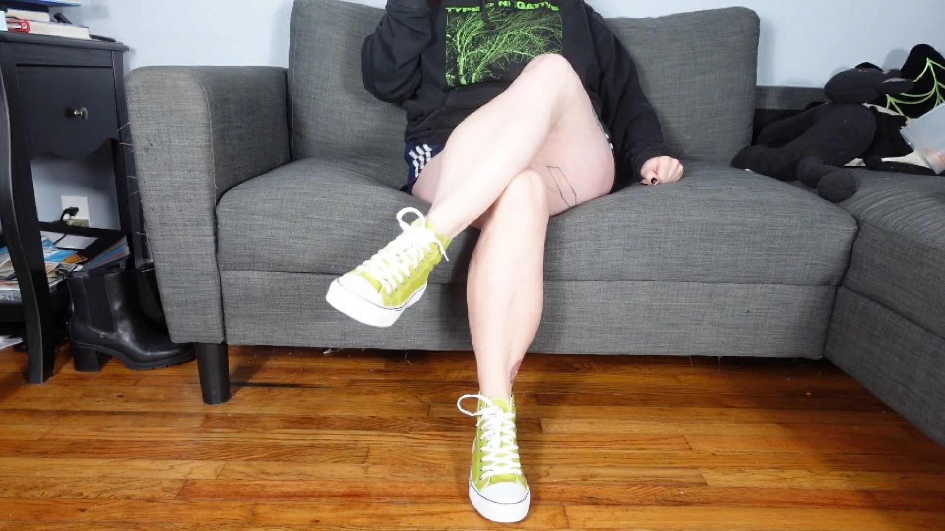 Crossed Legs in Lime Green Converse