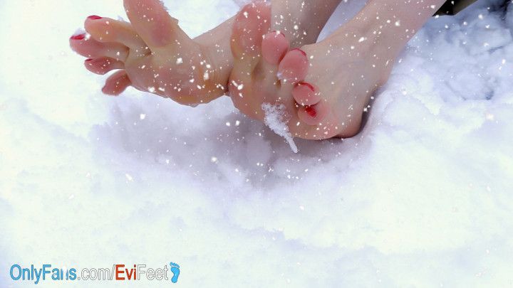 Happy Funny Feet Plays in the Snow