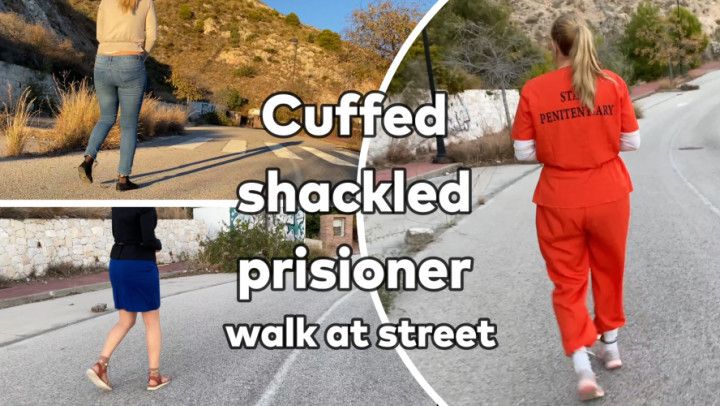 Cuffed shackled prisioner walk at street