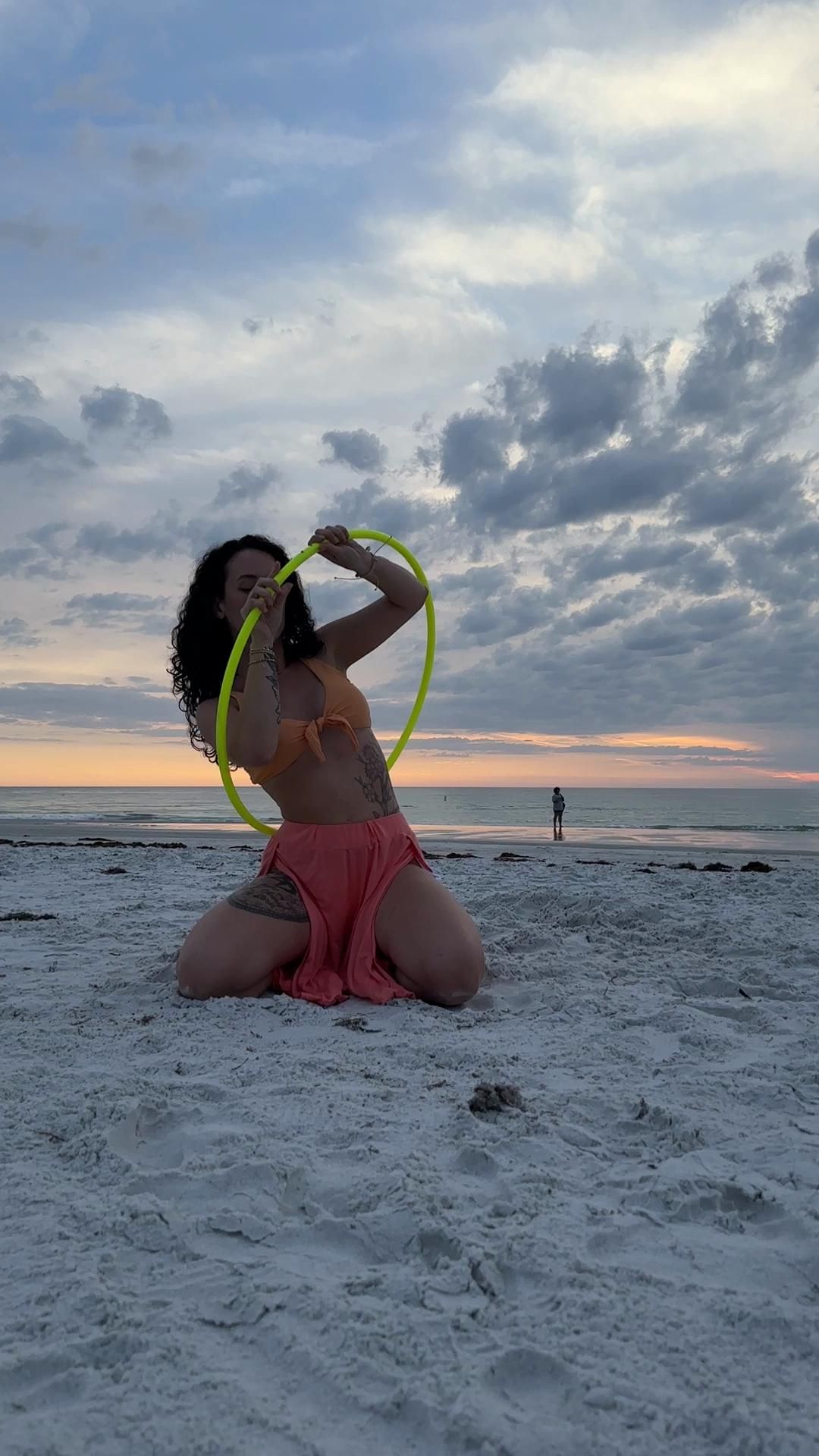 Hoop Flow On The Beach At Sunset In Pink Pants