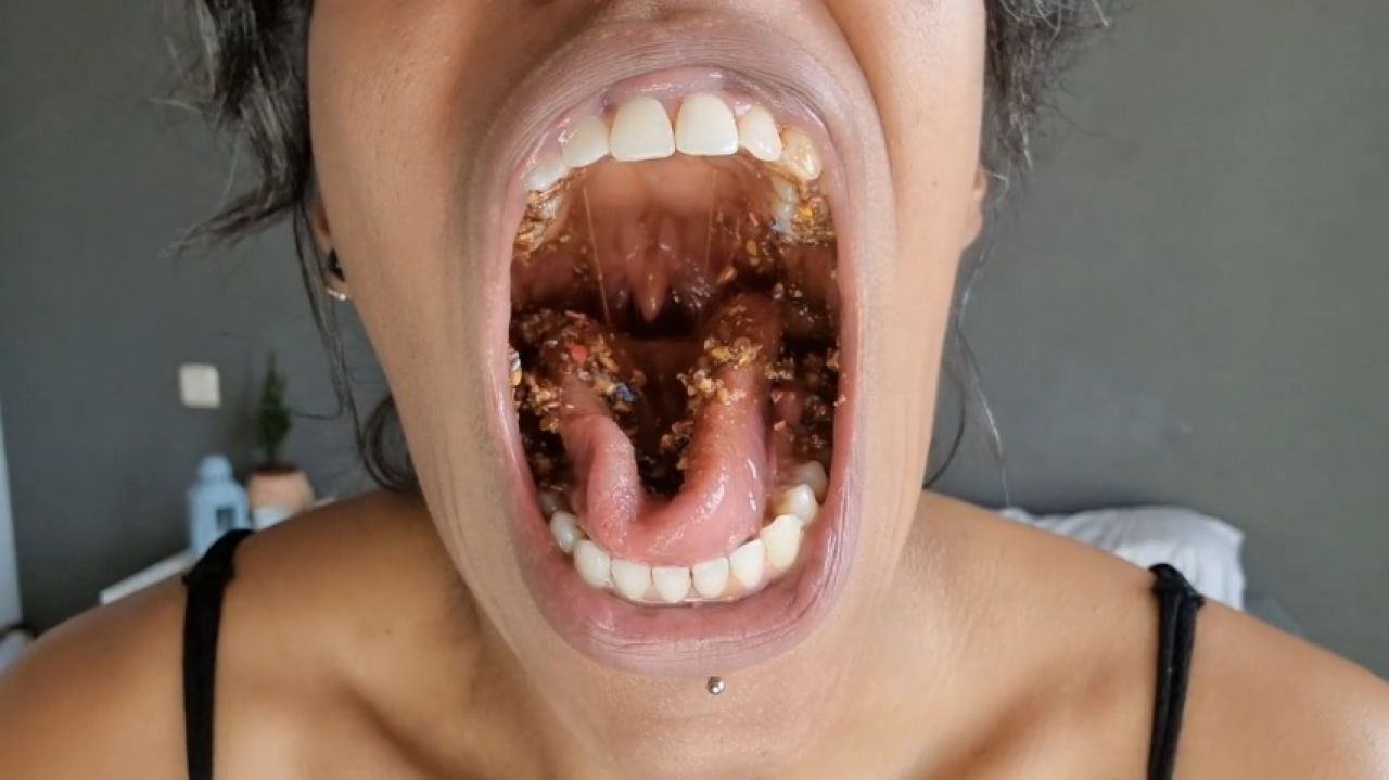 Chewing and destroying  chocolate covered peanuts