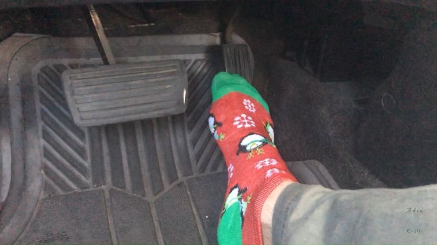 Guy Pumps Car Pedals In X-Mas Socks