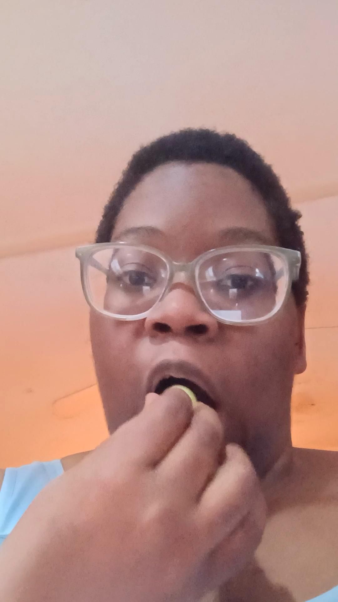 eating a handful of green grapes